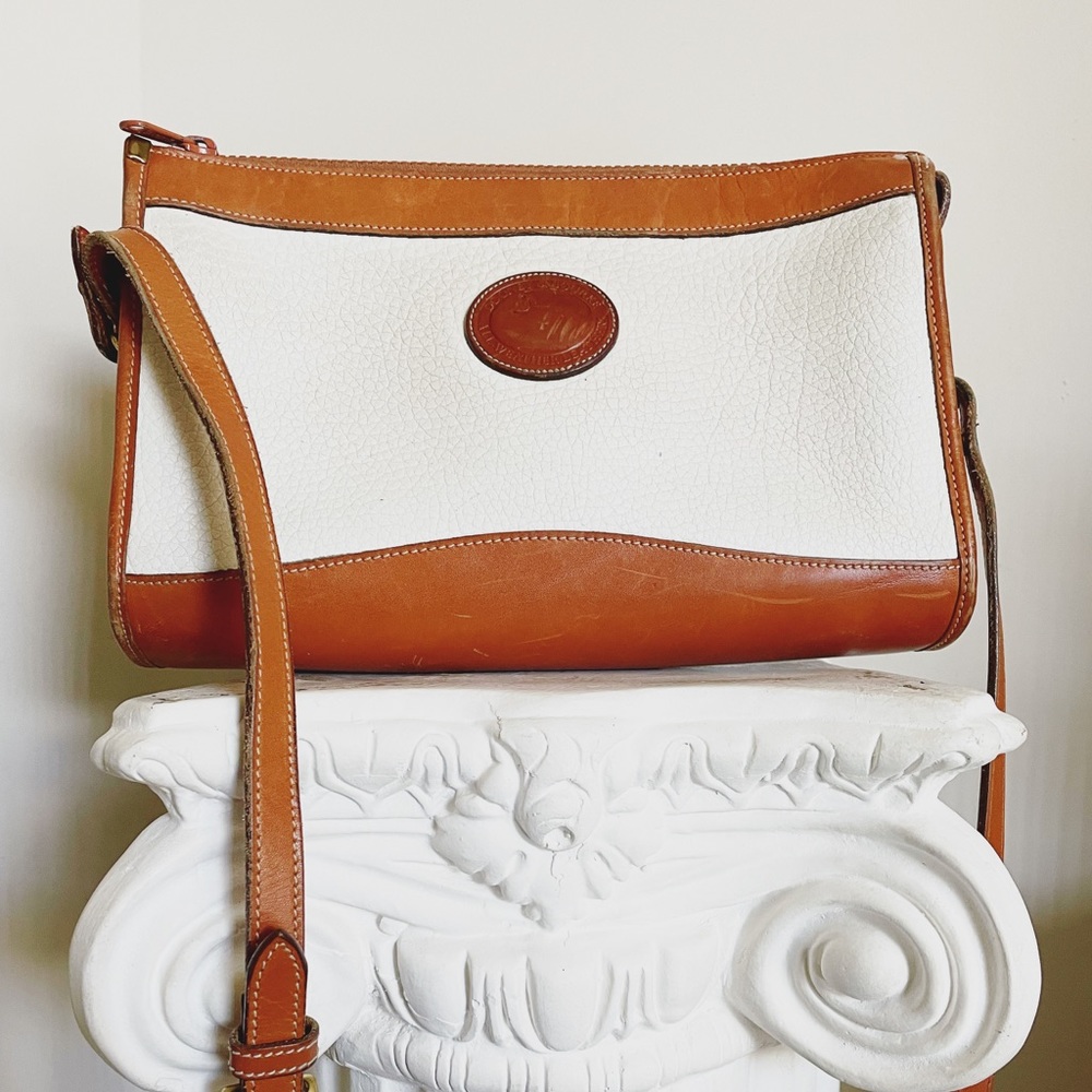 Dooney & Bourke tan and white leather crossbody bag